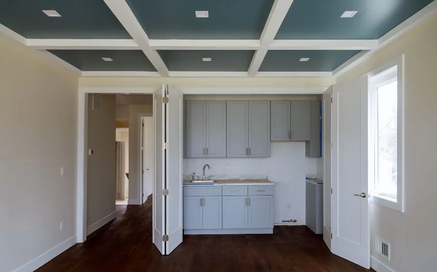 Coffered ceiling painted teal with crisp white beams and trim, painted gray cabinets below, Boca Raton, FL