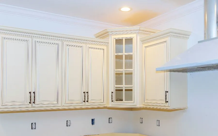 Cream painted kitchen cabinets with glazed detail and crown molding, Boynton Beach, FL