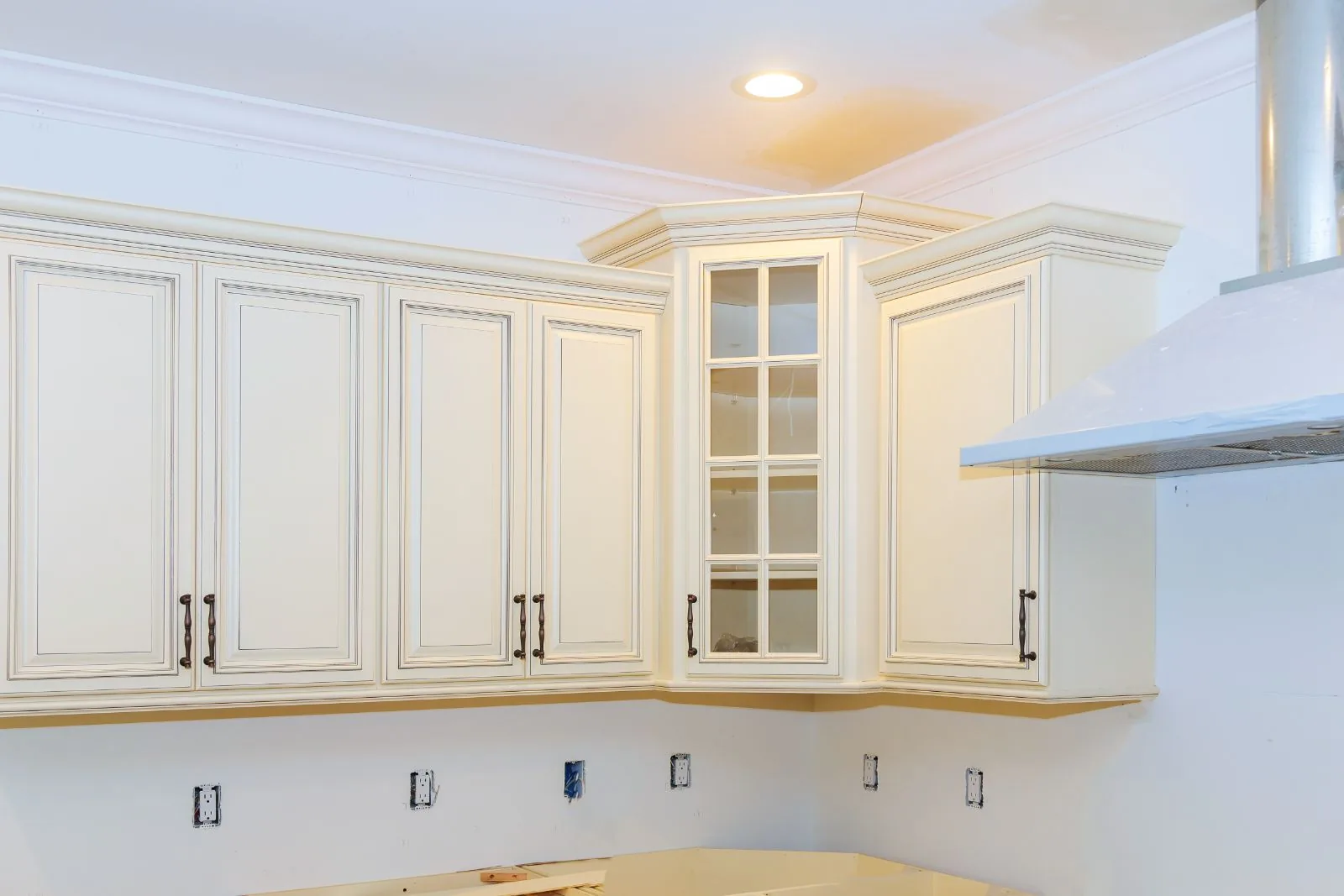Cream painted kitchen cabinets with glazed detail and crown molding, Boynton Beach, FL