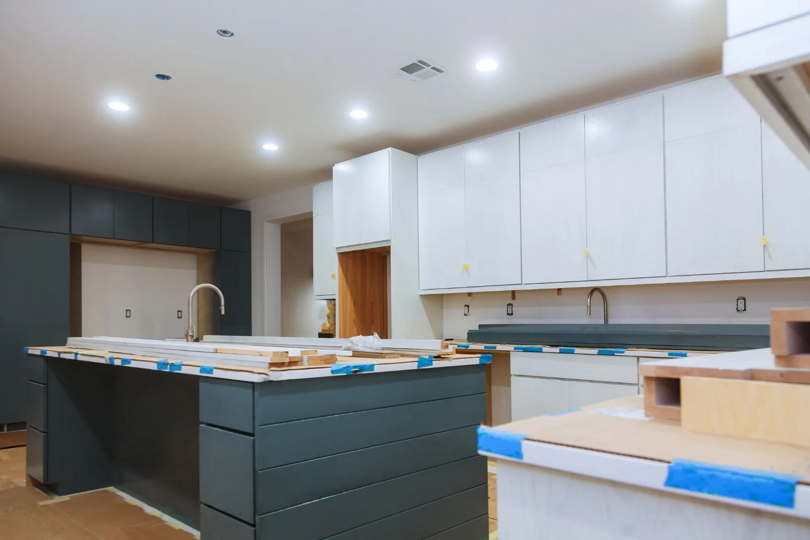 Two-tone kitchen cabinet painting with a dark green island and white upper cabinets, Lake Worth Beach, FL