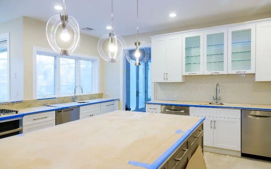 White shaker kitchen cabinets with countertops masked off during a cabinet repaint, Fort Lauderdale, FL