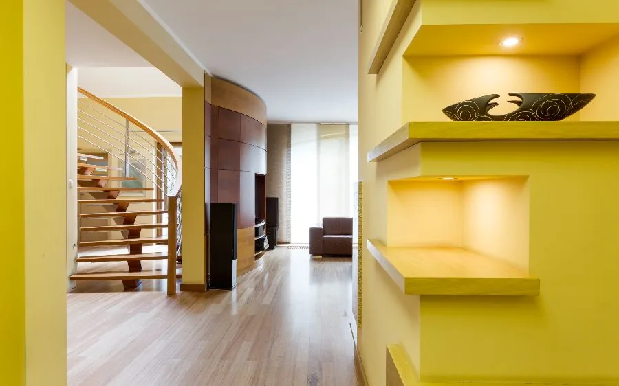 Yellow hallway, built-in shelves and staircase interior repaint with wood floors, Boynton Beach, FL